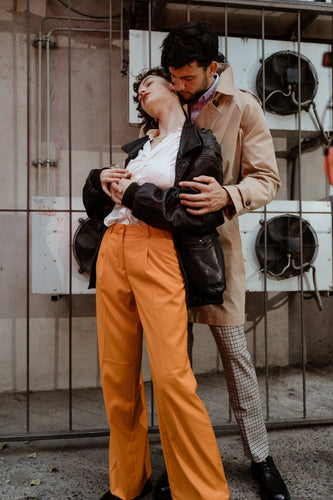A couple holding each other closely, symbolizing intimacy and the importance of understanding safe sex practices during vaginal infections like BV, yeast infections, or herpes.