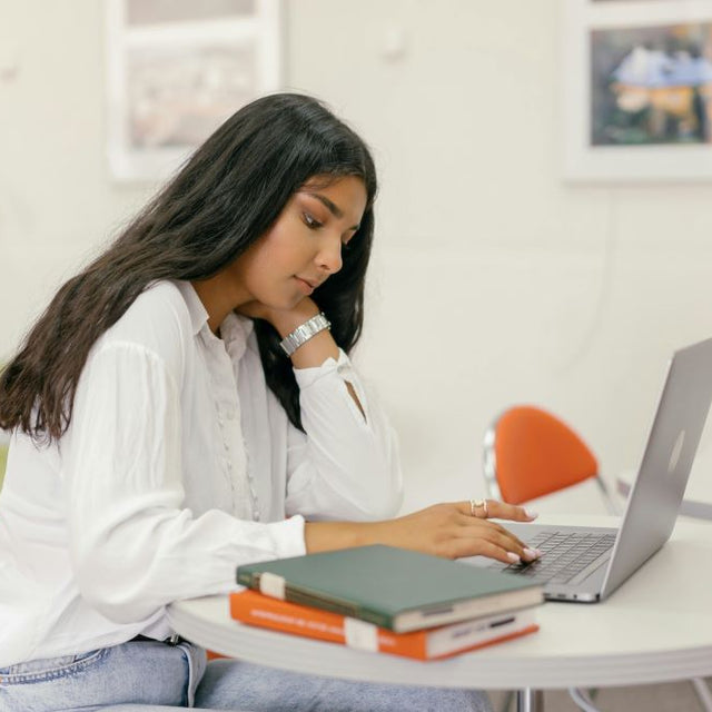 woman learning about UTI (Urinary Tract Infection) Symptoms and Medicine